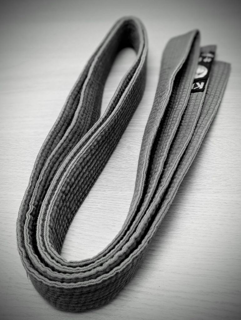 The karate belt I earned 20 years ago. It's a black and white photograph, but this belt is blue.